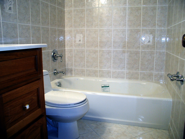 Ceramic wall tile and new tub installed