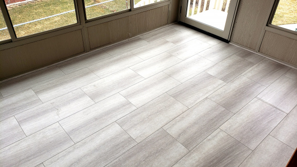 New floor tiles in the sunroom.jpg
