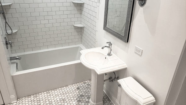 Bathroom after renovation in white-gray tone