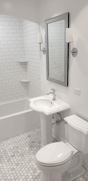 Bathroom after renovation in white-gray ton with subway tiles