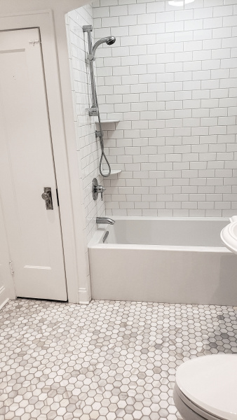 Bathroom after renovation in white-gray ton 