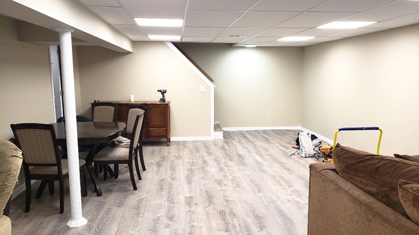 Basement after remodeling with suspended ceiling and 2x2 LED lights